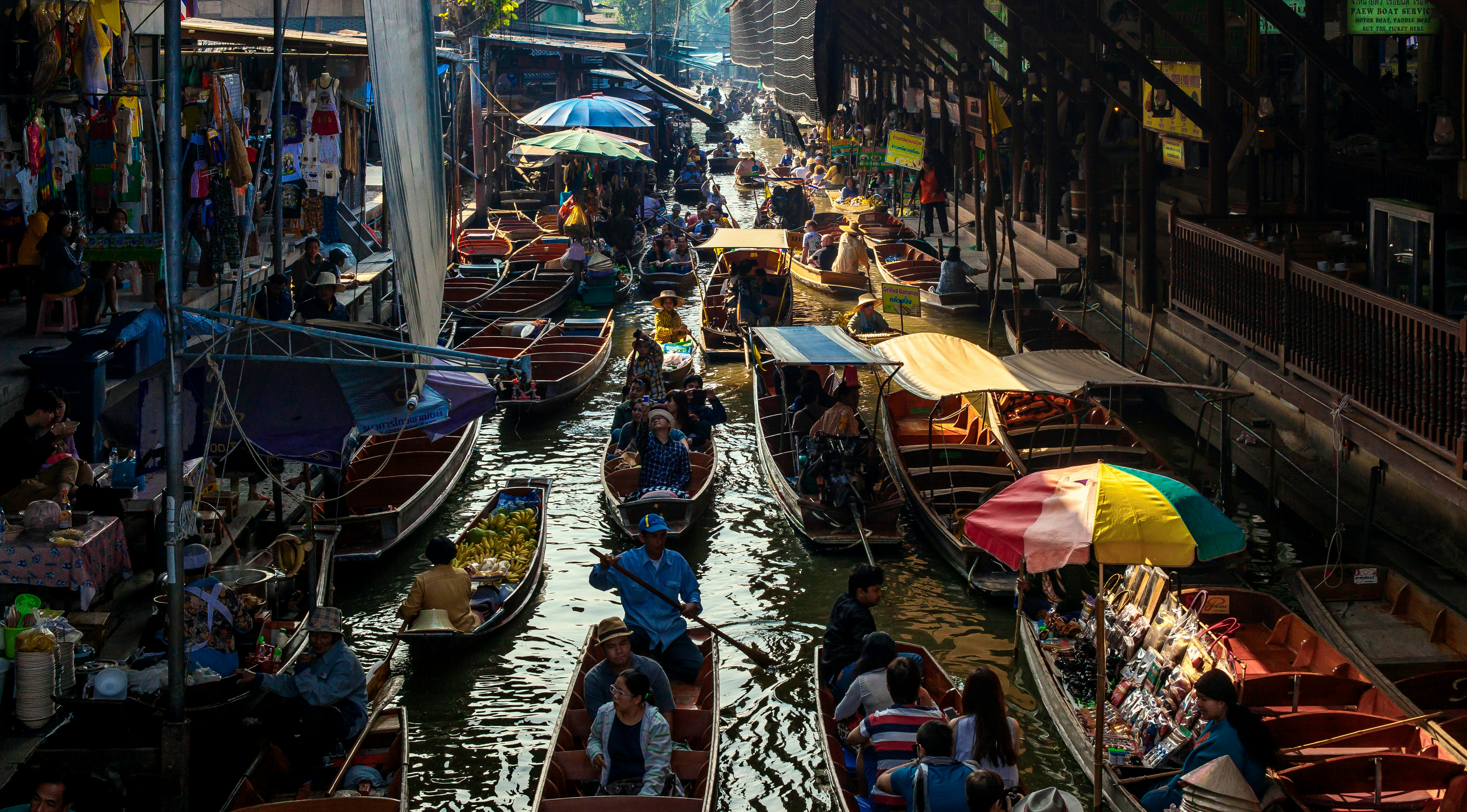 people riding on boat on river during daytime